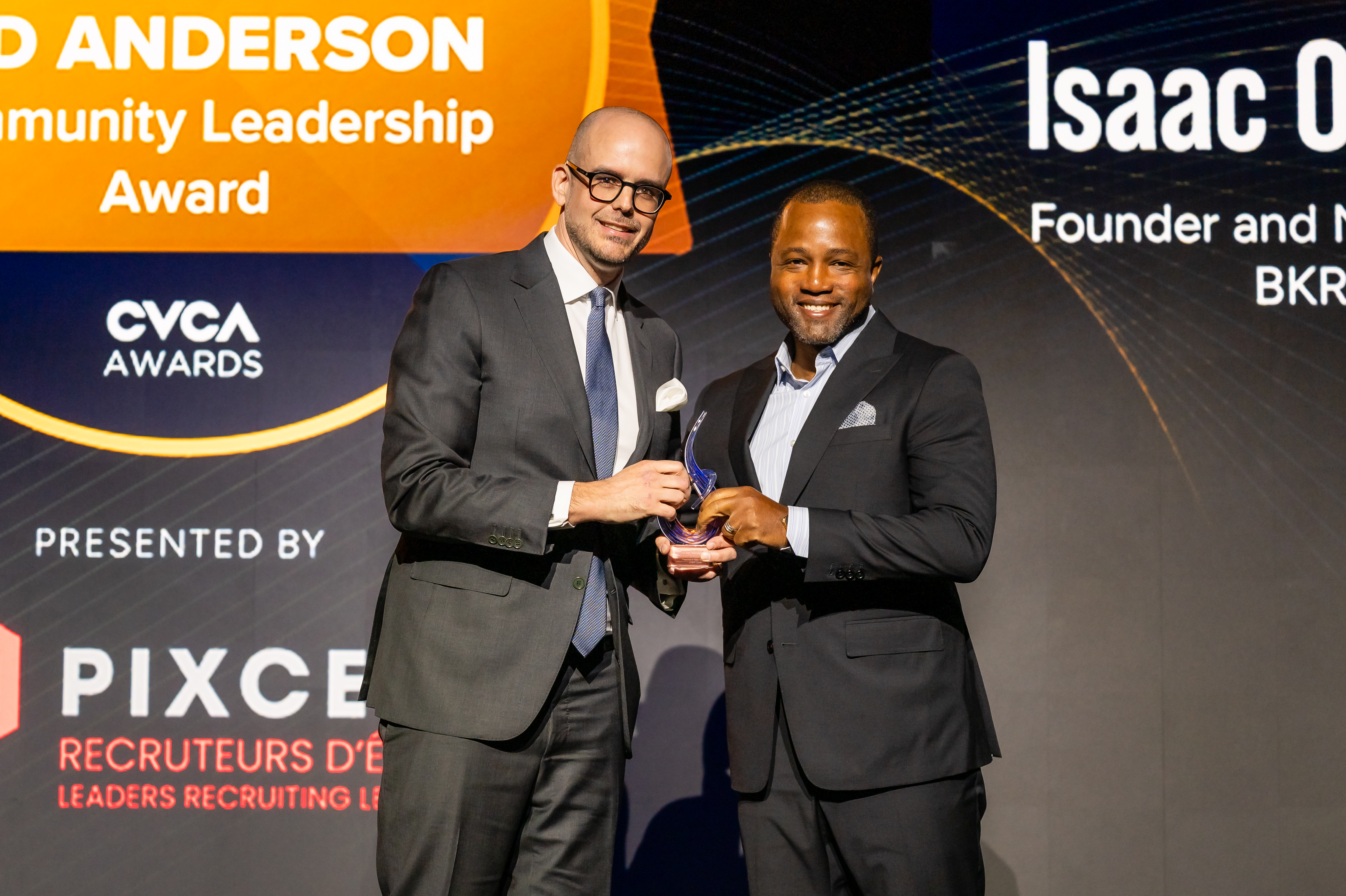 François Piché-Roy of PIXCELL presents the Ted Anderson Community Leadership Award to Isaac Olowolafe Jr., Co-Founder and General Partner of BKR Capital, at Invest Canada 26